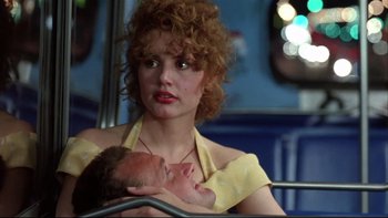 Movie still from “Quick Change” (1990), directed by Howard Franklin – A woman holding a baby on top of a bus; Close Up shot, Low angle