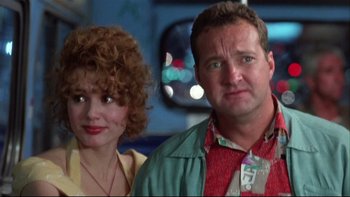 Movie still from “Quick Change” (1990), directed by Howard Franklin – A man and a woman standing next to each other; Close Up shot, Low angle