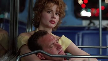 Movie still from “Quick Change” (1990), directed by Howard Franklin – A man and a woman sitting next to each other on a bus; Close Up shot, Low angle