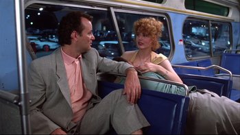 Movie still from “Quick Change” (1990), directed by Howard Franklin – A man and a woman sitting in the back of a car; Medium shot, Over the shoulder angle