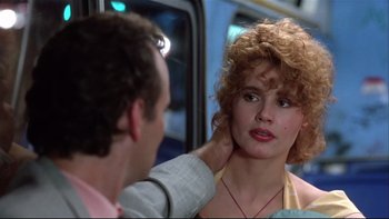 Movie still from “Quick Change” (1990), directed by Howard Franklin – A man touching the face of a young woman; Close Up shot, Over the shoulder angle