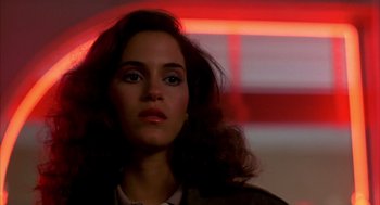 Movie still from “Quicksilver” (1986), directed by Thomas Michael Donnelly – A person with long hair; Close Up shot, Low angle