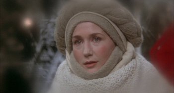 Movie still from “Quintet” (1979), directed by Robert Altman – A person wearing a hat and a scarf; Close Up shot, High angle