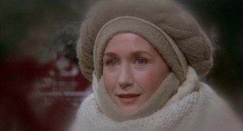 Movie still from “Quintet” (1979), directed by Robert Altman – A person wearing a hat and a scarf; Close Up shot, High angle