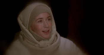 Movie still from “Quintet” (1979), directed by Robert Altman – A woman wearing a white robe and a head covering; Close Up shot, Low angle