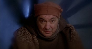 Movie still from “Quintet” (1979), directed by Robert Altman – A person wearing a hat; Close Up shot, Over the shoulder angle