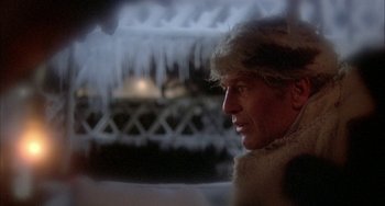 Movie still from “Quintet” (1979), directed by Robert Altman – A person wearing a fur coat; Close Up shot, Over the shoulder angle