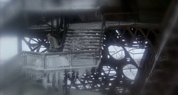 Movie still from “Quintet” (1979), directed by Robert Altman – A man standing in front of some stairs; Extreme Wide shot, High angle