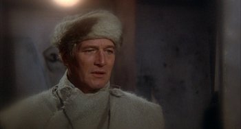 Movie still from “Quintet” (1979), directed by Robert Altman – A person wearing a hat; Close Up shot, Over the shoulder angle