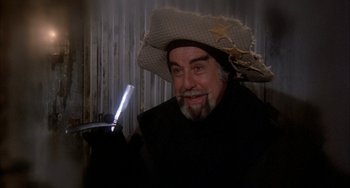 Movie still from “Quintet” (1979), directed by Robert Altman – A man with a cowboy hat and a beard; Close Up shot, Low angle