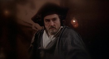 Movie still from “Quintet” (1979), directed by Robert Altman – A person wearing a hat; Close Up shot, Over the shoulder angle