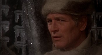 Movie still from “Quintet” (1979), directed by Robert Altman – A man wearing a fur hat; Close Up shot, Over the shoulder angle