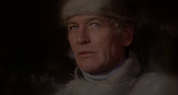 Movie still from “Quintet” (1979), directed by Robert Altman – A person wearing a hat; Close Up shot, Low angle