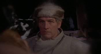 Movie still from “Quintet” (1979), directed by Robert Altman – A person wearing a fur hat; Close Up shot, Over the shoulder angle