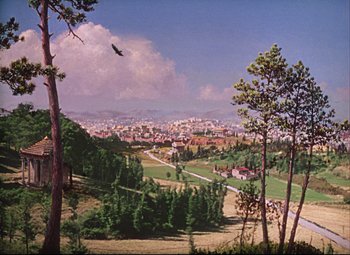 Movie still from “Quo Vadis” (1951), directed by Anthony Mann – An aerial view of a city with a bird flying above; Extreme Wide shot, High angle