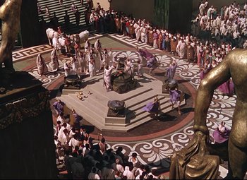 Movie still from “Quo Vadis” (1951), directed by Anthony Mann – A crowd of people gathered around a stage in a theater; Extreme Wide shot, High angle