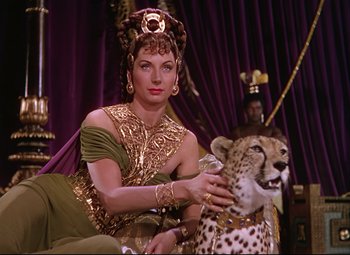 Movie still from “Quo Vadis” (1951), directed by Anthony Mann – A woman sitting on top of a cheetah; Medium shot, High angle