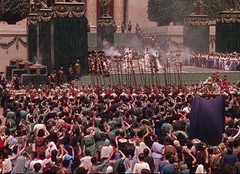 Movie still from “Quo Vadis” (1951), directed by Anthony Mann – A crowd of people sitting on the ground; Extreme Wide shot, High angle