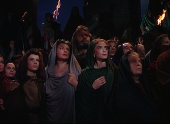 Movie still from “Quo Vadis” (1951), directed by Anthony Mann – A group of people standing in front of a building; Medium shot, Low angle