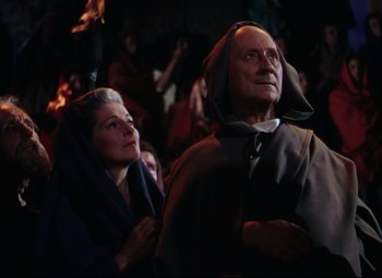 Movie still from “Quo Vadis” (1951), directed by Anthony Mann – A man and a woman dressed in medieval garb; Medium shot, Low angle