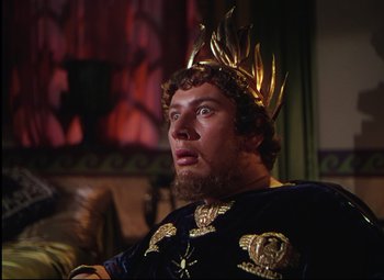 Movie still from “Quo Vadis” (1951), directed by Anthony Mann – A man with a beard wearing a crown; Close Up shot, High angle