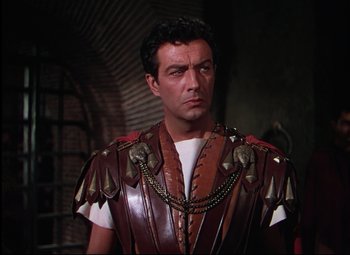 Movie still from “Quo Vadis” (1951), directed by Anthony Mann – A person wearing a costume; Medium shot, Low angle