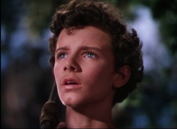 Movie still from “Quo Vadis” (1951), directed by Anthony Mann – A person with curly hair and blue eyes; Close Up shot, High angle