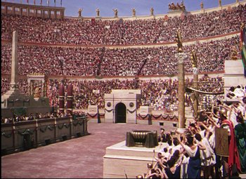 Movie still from “Quo Vadis” (1951), directed by Anthony Mann – A crowd of people standing in front of an arena; Extreme Wide shot, High angle
