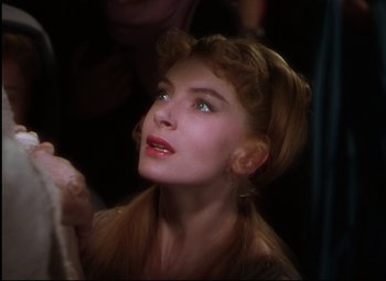 Movie still from “Quo Vadis” (1951), directed by Anthony Mann – A beautiful woman with red hair looking up; Close Up shot, Over the shoulder angle