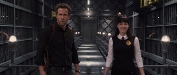 Movie still from “R.I.P.D.” (2013), directed by Robert Schwentke – A man and a woman standing next to each other; Medium shot, Low angle