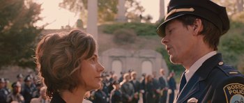 Movie still from “R.I.P.D.” (2013), directed by Robert Schwentke – A man and a woman in front of a group of people; Close Up shot, Over the shoulder angle