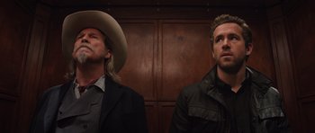Movie still from “R.I.P.D.” (2013), directed by Robert Schwentke – Two men standing next to each other in front of a wooden wall; Close Up shot, Low angle