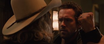 Movie still from “R.I.P.D.” (2013), directed by Robert Schwentke – A person wearing a cowboy hat; Close Up shot, Over the shoulder angle