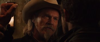 Movie still from “R.I.P.D.” (2013), directed by Robert Schwentke – A person wearing a cowboy hat; Close Up shot, Over the shoulder angle