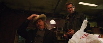 Movie still from “R.I.P.D.” (2013), directed by Robert Schwentke – A man in a cowboy hat sitting next to another man in a cowboy hat; Medium shot, Over the shoulder angle