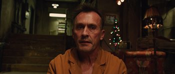 Movie still from “R.I.P.D.” (2013), directed by Robert Schwentke – A person wearing a shirt; Close Up shot, Low angle