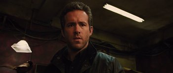 Movie still from “R.I.P.D.” (2013), directed by Robert Schwentke – A person wearing a jacket; Close Up shot, Low angle