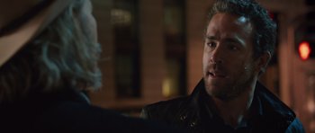 Movie still from “R.I.P.D.” (2013), directed by Robert Schwentke – A person wearing a leather jacket; Close Up shot, Over the shoulder angle