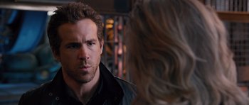 Movie still from “R.I.P.D.” (2013), directed by Robert Schwentke – A person looking at a person; Close Up shot, Over the shoulder angle