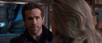 Movie still from “R.I.P.D.” (2013), directed by Robert Schwentke – A person looking at a person in a mirror; Close Up shot, Over the shoulder angle