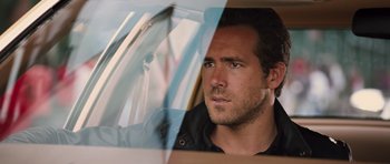 Movie still from “R.I.P.D.” (2013), directed by Robert Schwentke – A person in a car; Close Up shot, Over the shoulder angle