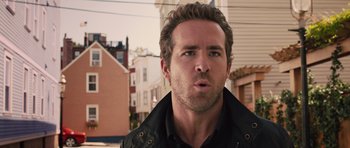 Movie still from “R.I.P.D.” (2013), directed by Robert Schwentke – A person wearing a black jacket; Close Up shot, Over the shoulder angle