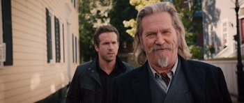 Movie still from “R.I.P.D.” (2013), directed by Robert Schwentke – A man with long white hair standing next to a man with short white hair; Close Up shot, Over the shoulder angle