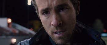 Movie still from “R.I.P.D.” (2013), directed by Robert Schwentke – A person with a beard; Close Up shot, Over the shoulder angle