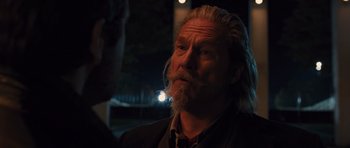 Movie still from “R.I.P.D.” (2013), directed by Robert Schwentke – A man with long white hair and a beard is talking to someone; Close Up shot, Over the shoulder angle