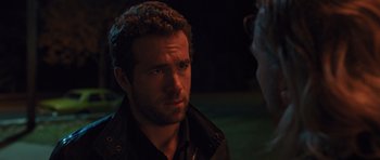 Movie still from “R.I.P.D.” (2013), directed by Robert Schwentke – A person wearing a black shirt; Close Up shot, Over the shoulder angle