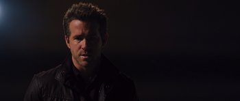 Movie still from “R.I.P.D.” (2013), directed by Robert Schwentke – A person wearing a jacket; Close Up shot, Over the shoulder angle