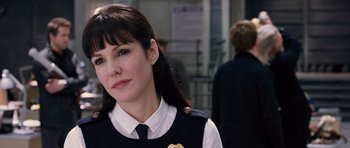 Movie still from “R.I.P.D.” (2013), directed by Robert Schwentke – A woman in a police uniform is looking at the camera; Close Up shot, Over the shoulder angle