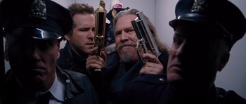 Movie still from “R.I.P.D.” (2013), directed by Robert Schwentke – A group of men holding guns in a room; Medium shot, Low angle