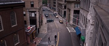Movie still from “R.I.P.D.” (2013), directed by Robert Schwentke – Two people are crossing the street in the middle of the city; Extreme Wide shot, High angle